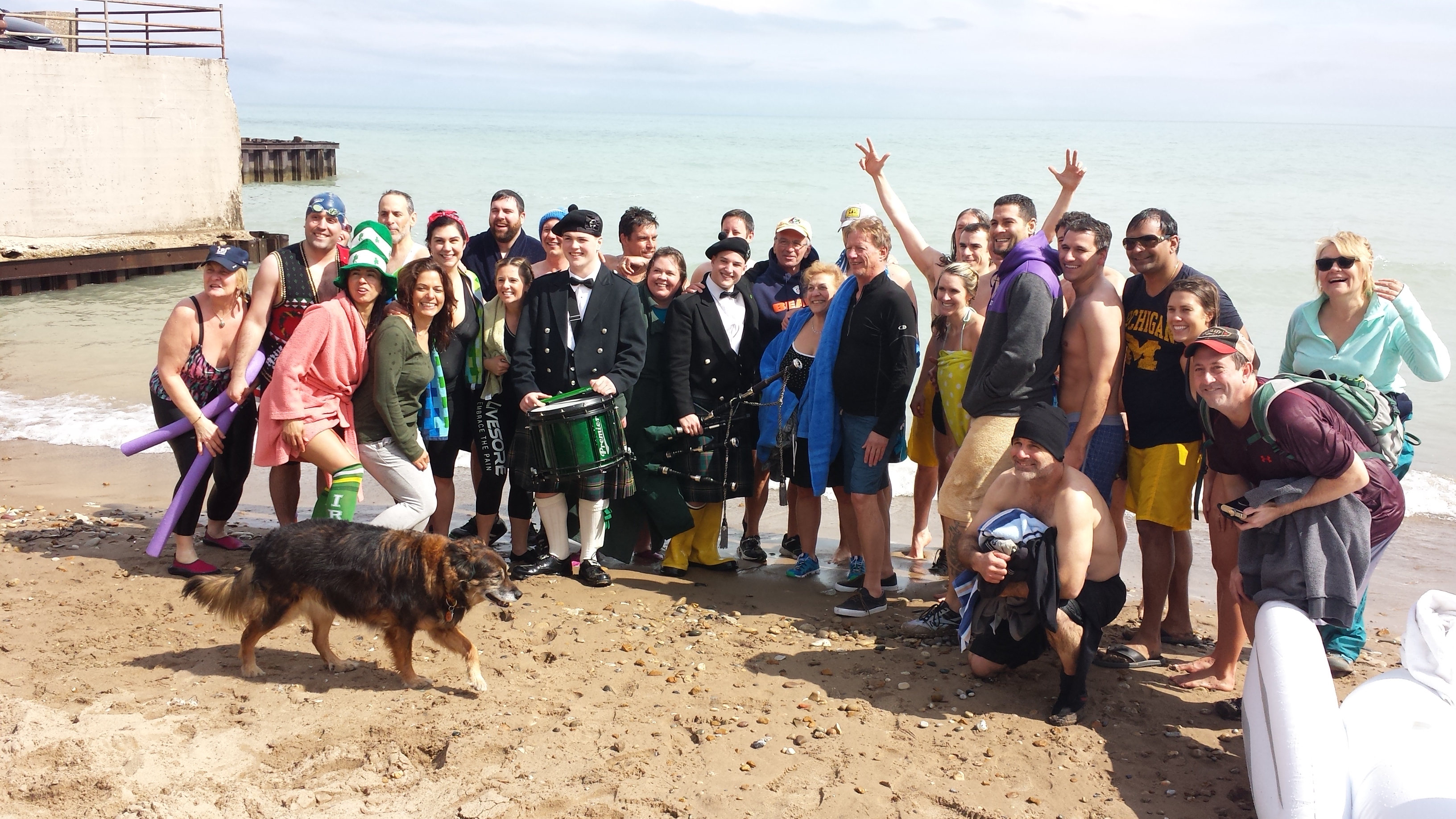 Group photo with bagpiper at Fargo Beach